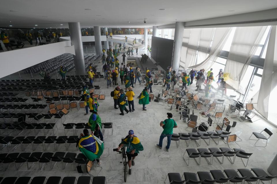 Protesters, supporters of Brazil's former President Jair Bolsonaro, storm the Planalto Palace in Brasilia, Brazil, Sunday, Jan. 8, 2023.