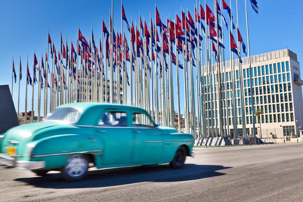 The US embassy in Havana seen behind an array of Cuban flags. In all, 26 US diplomatic staff suffered the effects of 'Havana syndrome': Getty