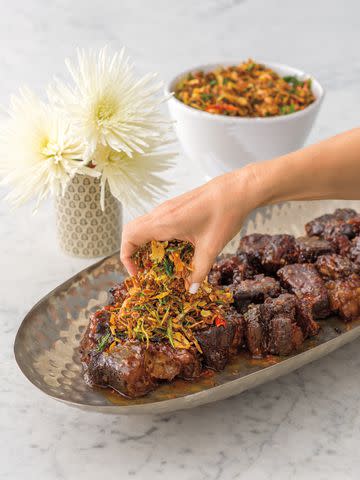 <p>SERVED images photographed by Mark Wilkinson</p> Caroline Somers' Braised Short Ribs With Crispy Ginger Chili Herbs