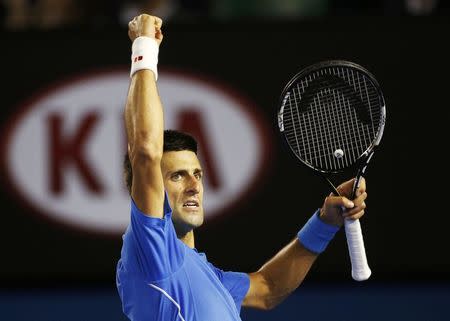 Novak Djokovic of Serbia reacts after winning a point against Andy Murray of Britain during their men's singles final match at the Australian Open 2015 tennis tournament in Melbourne February 1, 2015. REUTERS/Athit Perawongmetha