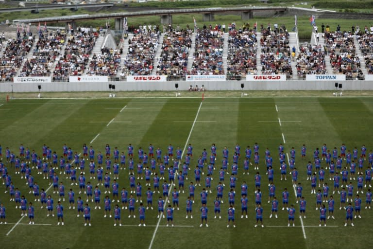 Students perform during the opening ceremony of the Kamaishi Recovery Memorial stadium