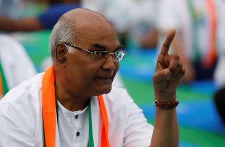 Ram Nath Kovind, nominated presidential candidate of the Bharatiya Janata Party (BJP), gestures as he attends an International Yoga Day event in New Delhi, June 21, 2017. REUTERS/Adnan Abidi