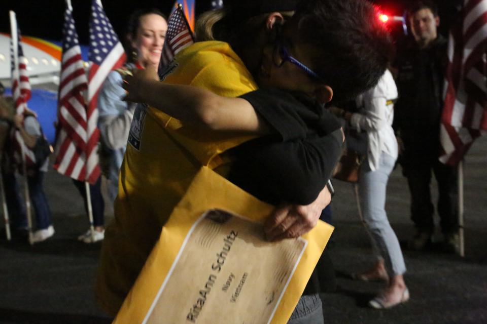 Ritaann Schultz hugs her grandson as she returns to Tallahassee, April 27, 2024.