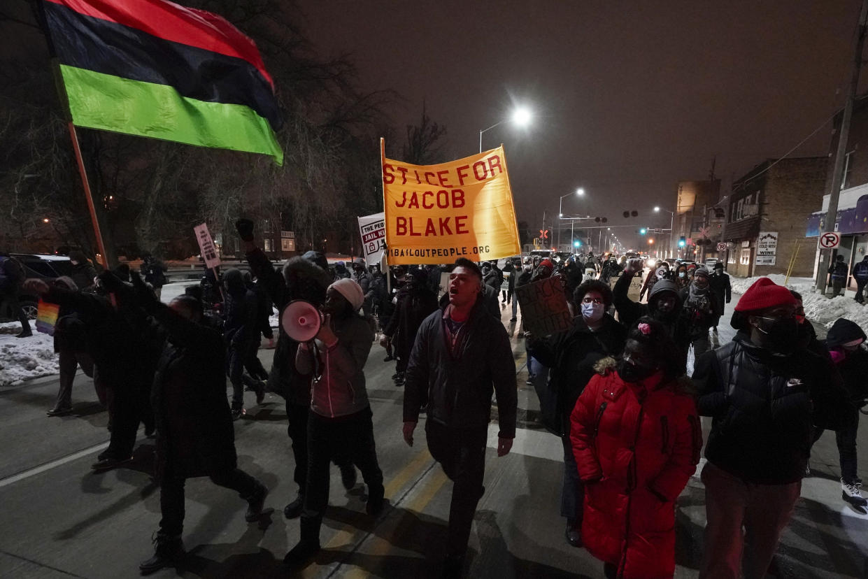 Supporters for Jacob Blake march Monday, Jan. 4, 2021, in Kenosha, Wis. Kenosha Police Officer Rusten Sheskey opened fire on Blake in August after responding to a domestic dispute, leaving him paralyzed. (AP Photo/Morry Gash)