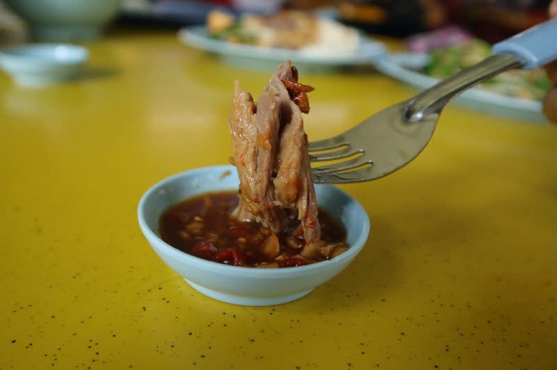 home treasure salted duck - closeup of duck soaked in chilli