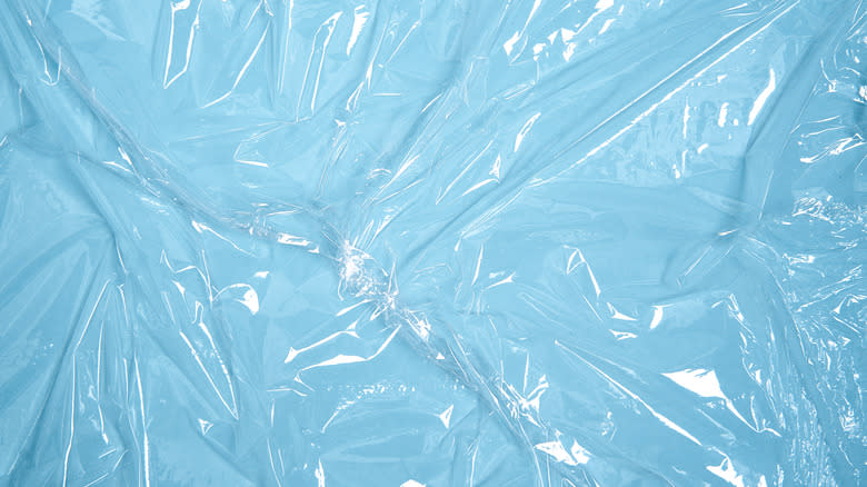 Sheet of plastic wrap on a pale blue background