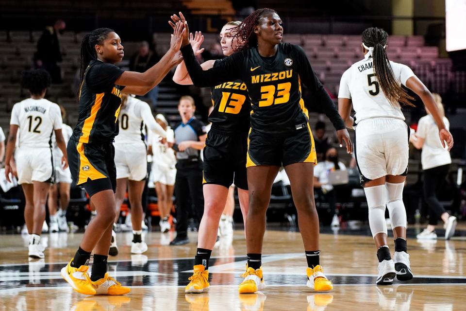 Missouri guards Mama Dembele (4), Haley Troup (13) and Aijha Blackwell (33) react after defeating Vanderbilt 66-52  on Thursday at Memorial Gym in Nashville, Tenn.