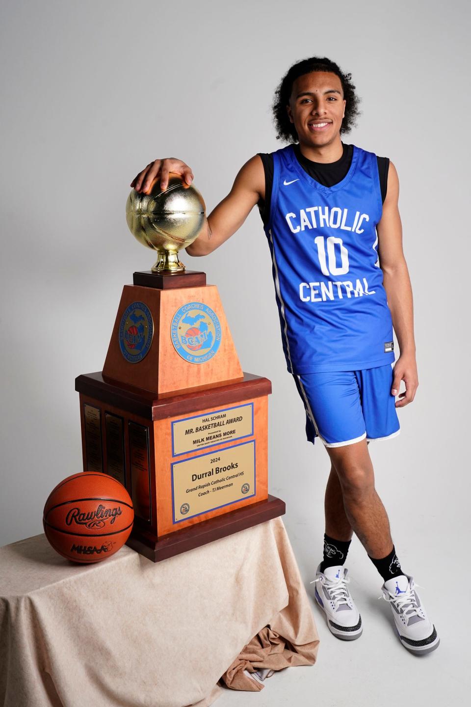 Grand Rapids Catholic Central Durral Brooks accepts the 2024 Hal Schram Mr. Basketball award at the Detroit Free Press on Monday, March 11, 2024.