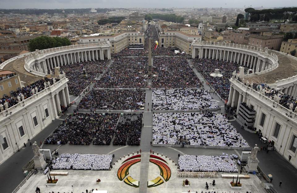 Faithful fill St. Peter's Square at the Vatican, Sunday, April 27, 2014. Pope Francis has declared his two predecessors John XXIII and John Paul II saints in an unprecedented canonization ceremony made even more historic by the presence of retired Pope Benedict XVI. (AP Photo/Andrew Medichini)