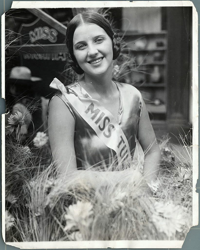 closeup of Smallwood smiling by some flowers