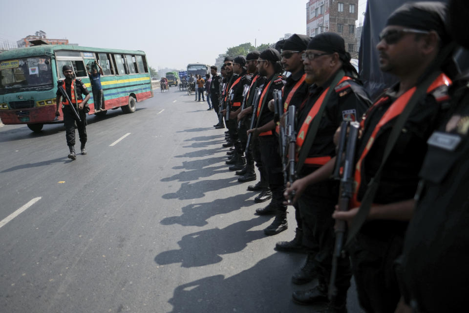 Rapid Action Battalion (RAB) members patrol in Dhaka - Chittagong highway during a a three-day blockade called by main opposition Bangladesh Nationalist Party (BNP) in Dhaka, Bangladesh, Tuesday, Oct.31, 2023. BNP has called for country-wide blockade to demand the resignation of Prime Minister Sheikh Hasina and the transfer of power to a non-partisan caretaker government to oversee general elections. (AP Photo/Mahmud Hossain Opu)