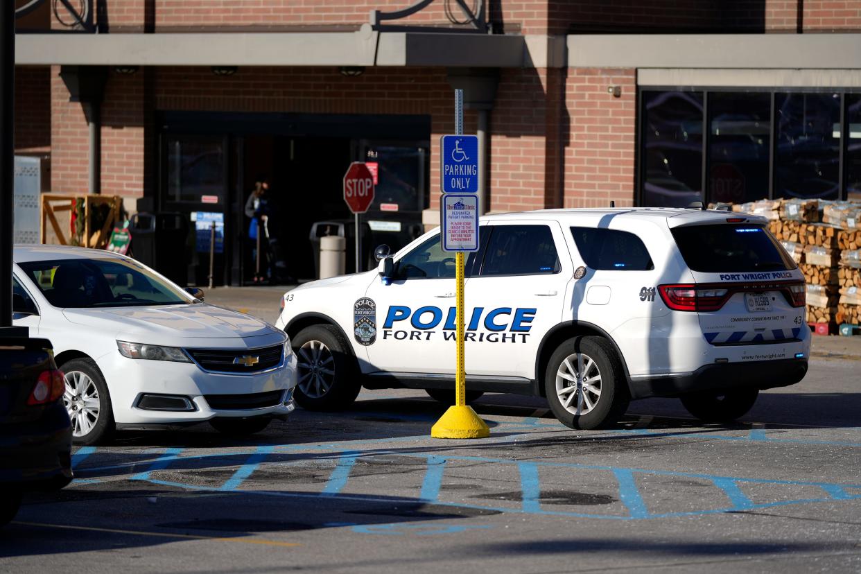 A Fort Wright police car sits near an entrance to Kroger in Fort Mitchell on Tuesday. Fort Mitchell Police Chief Robert Nader said that there was no active threat to the public after a shooting near the Kroger gas station.