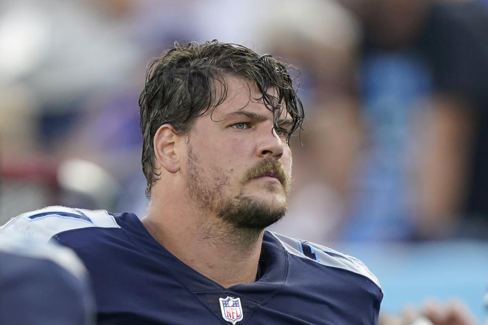 FILE - Tennessee Titans offensive tackle Taylor Lewan walks off the field at halftime of an NFL football game against the New York Giants, Sunday, Sept. 11, 2022, in Nashville, Tenn. A three-time Pro Bowl left tackle released by the Tennessee Titans in February over a failed physical issue is suing renowned orthopedist Dr. James Andrews for medical malpractice after the October 2020 surgery repairing his torn right ACL left him with “severe and permanent” damage. Attorneys for Taylor Lewan filed the lawsuit Tuesday night, May 2, 2023, in circuit court in Ecambia County, Florida. (AP Photo/Mark Humphrey, File)