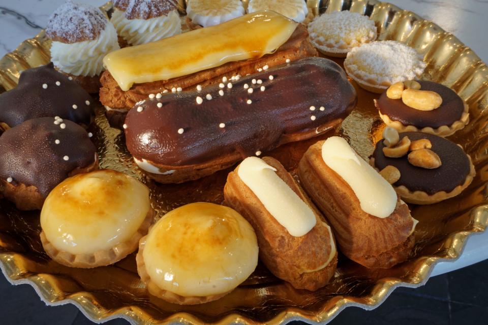 Madrid European Bakery offers Old World pastries such as the Creme Brulee and Chocolate Eclair, surrounded by Reposteria, mini desserts.