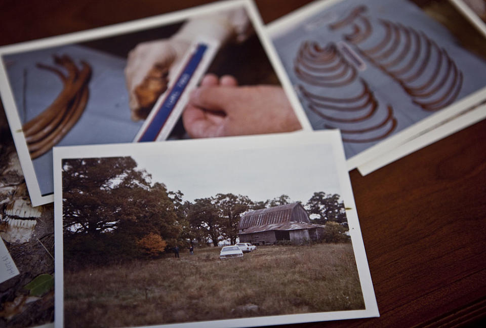 Several photographs are laid out on a surface, depicting various subjects, one with a person handling film