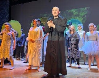 Ellis Rebholz (center, in black) portrays Uncle Fester in Riverside High School's 'The Addams Family' musical from March 21-24, 2024.