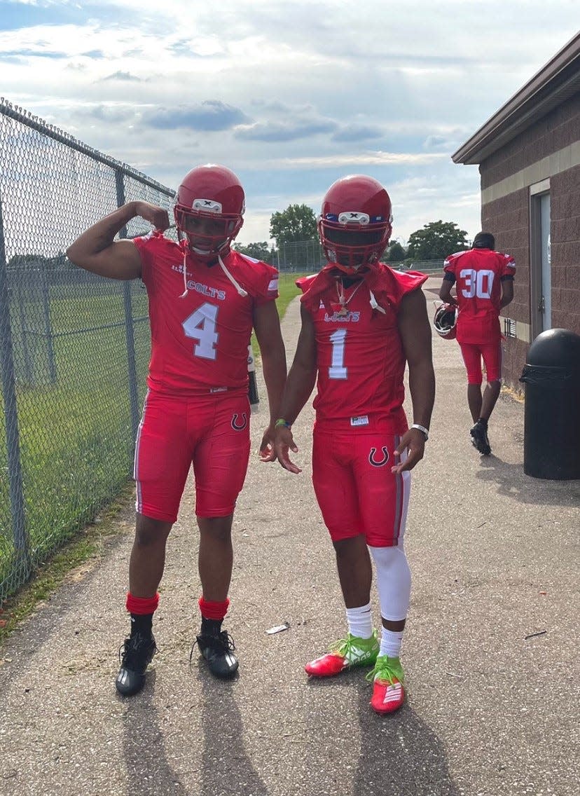 Cartier Woods, left, and Khanye Howard, right, playing football for Northwestern High School.