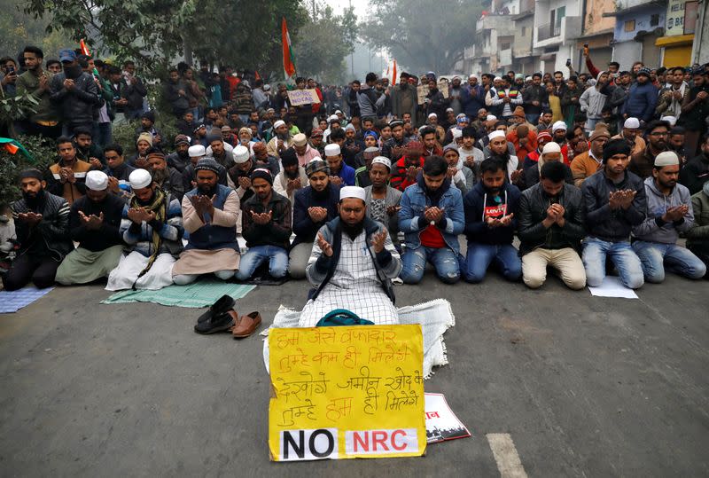 Muslims offer prayers during a protest against a new citizenship law, in Delhi