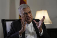 Sri Lanka's new prime minister Ranil Wickremesinghe gestures during an interview with The Associated Press in Colombo, Sri Lanka, Saturday, June 11, 2022. Sri Lanka may be compelled to buy more oil from Russia amid the island nation's unprecedented economic crisis, even as Western nations have largely boycotted Moscow as punishment for its invasion of Ukraine, the newly appointed prime minister said. (AP Photo/Eranga Jayawardena)