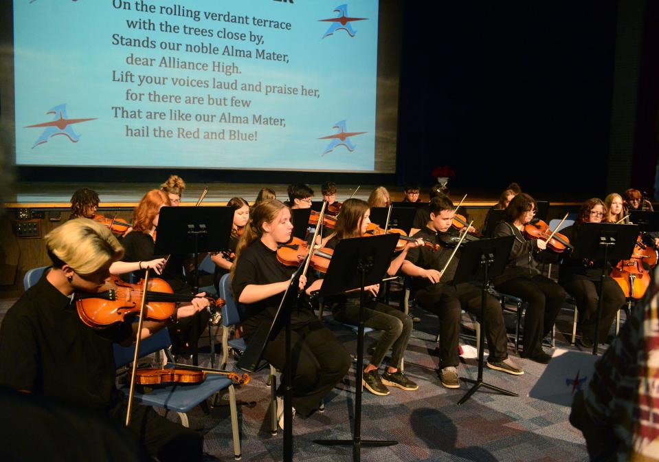 The Alliance High School Orchestra performs the school's Alma Mater during the 2023 Distinguished Alumni Induction Ceremony on Monday, Oct. 2, 2023, in Alliance High School's auditorium.
