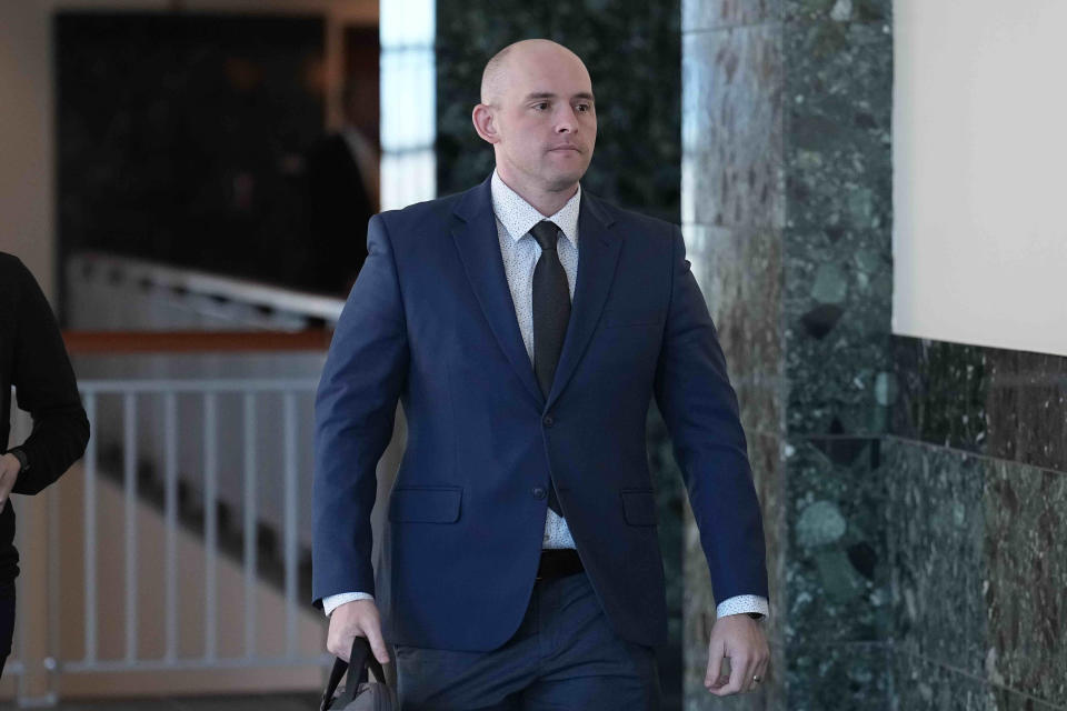 Defendant Jason Rosenblatt walks into the Adams County Justice Center for the start of a trial of two of the police officers charged in the death of Elijah McClain, Wednesday, Sept. 20, 2023, in Brighton Colo. (AP Photo/Jack Dempsey)