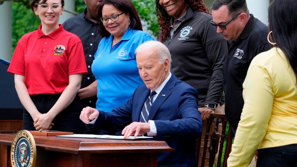 PHOTO: President Joe Biden sits down to sign a document imposing major new tariffs on electric vehicles, semiconductors, solar equipment and medical supplies imported from China in the Rose Garden of the White House in Washington, DC, May 14, 2024. (Susan Walsh/AP)