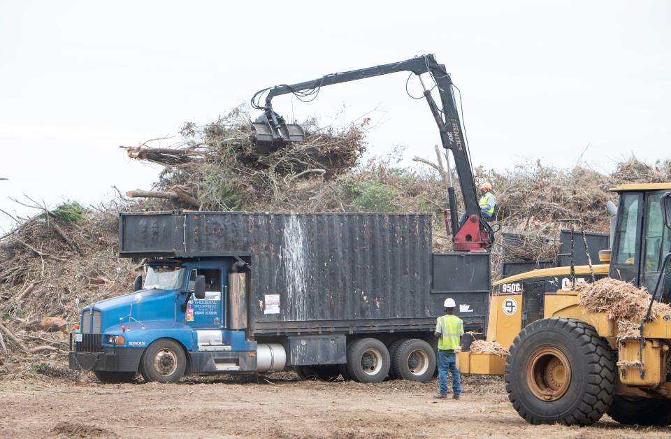A mountain of yard debris from Hurricane Sally is collected and converted into mulch at a debris disposal center on North 12th Avenue in Pensacola on Oct. 6, 2020.