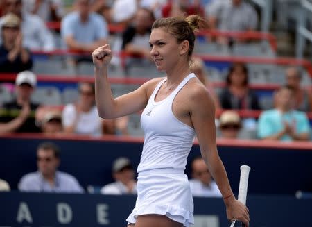 Jul 29, 2016; Montreal, Quebec, Canada; Simona Halep of Romania reacts after defeating Svetlana Kuznetsova of Russia (not pictured) on day five of the Rogers Cup tennis tournament at Uniprix Stadium. Mandatory Credit: Eric Bolte-USA TODAY Sports