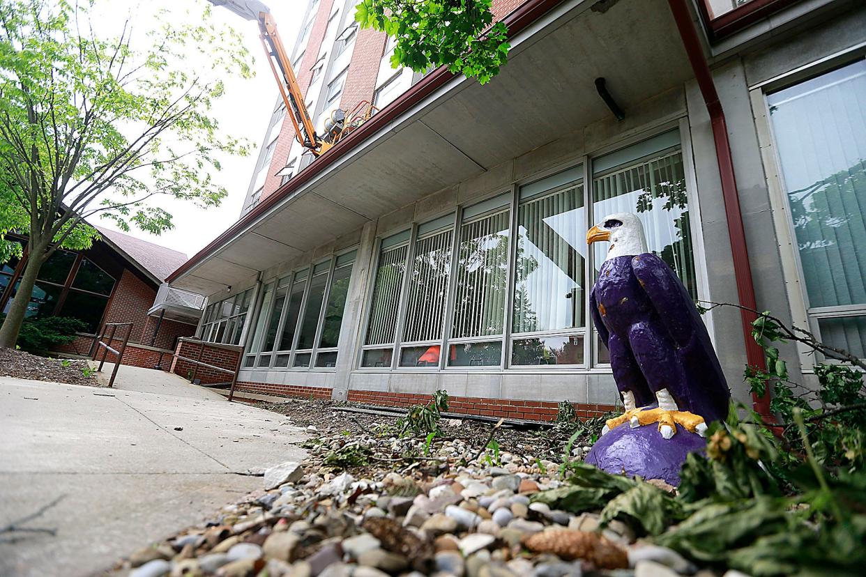 A worker performs some of the exterior projects at Clayton Hall at Ashland University. The work here was being done Wednesday, May 25, 2022. TOM E. PUSKAR/TIMES-GAZETTE.COM