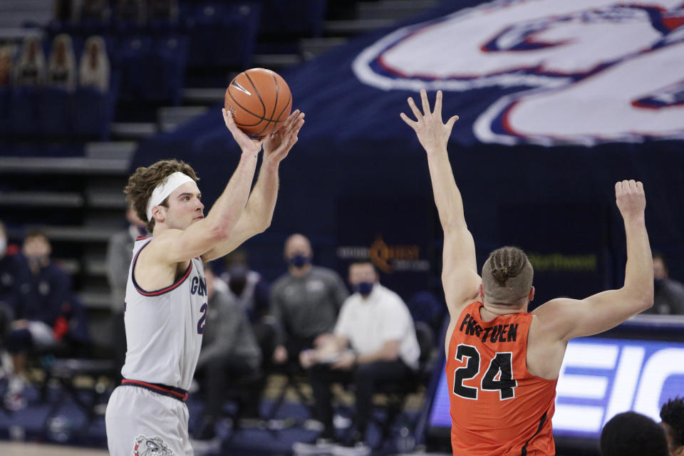 Gonzaga forward Corey Kispert shoots over Pacific guard Broc Finstuen during the first half of an NCAA college basketball game in Spokane, Wash., Saturday, Jan. 23, 2021. (AP Photo/Young Kwak)