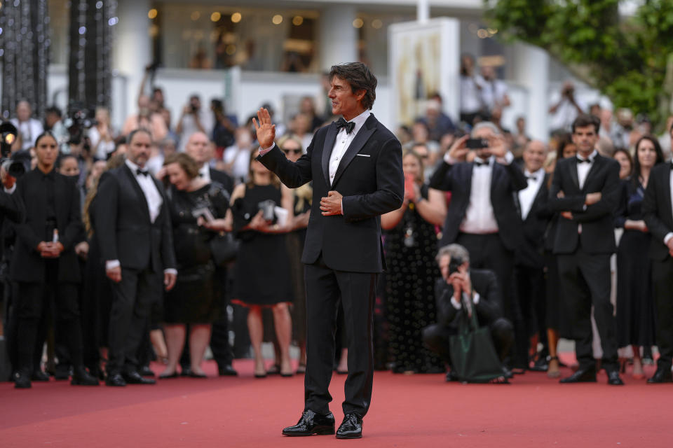 Tom Cruise poses for photographers upon arrival at the premiere of the film 'Top Gun: Maverick' at the 75th international film festival, Cannes, southern France, Wednesday, May 18, 2022. (AP Photo/Petros Giannakouris)