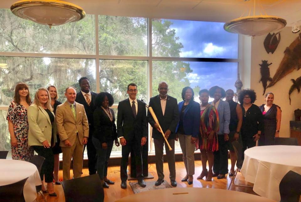 Florida A&M University President Larry Robinson (seventh from right), FAMU School of Nursing Dean Shelley Johnson (sixth from right), Wiley Executive Vice President and General Manager of University Services and Talent Development Todd Zipper (seventh from left) and other officials of FAMU and Wiley take a photo during a signing ceremony to celebrate the launching of FAMU's three new MSN degree nursing tracks.