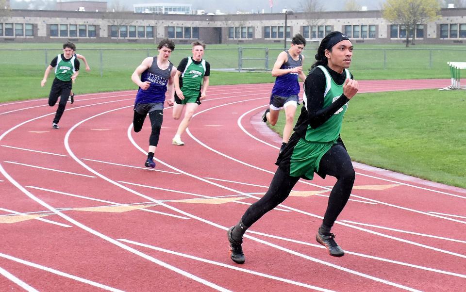 Herkimer Magician Joaquin Nietes leads runners out of curve on his way to a win in the 200-meter dash at Wednesday's dual meet against West Canada Valley.