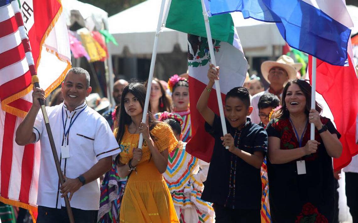 Fresno City Councilmember Miguel Arias is joined by his children and colleague Esmeralda Soria in the Sept. 17, 2022 parade that kicked off the Fiestas Patrias celebration in downtown Fresno.