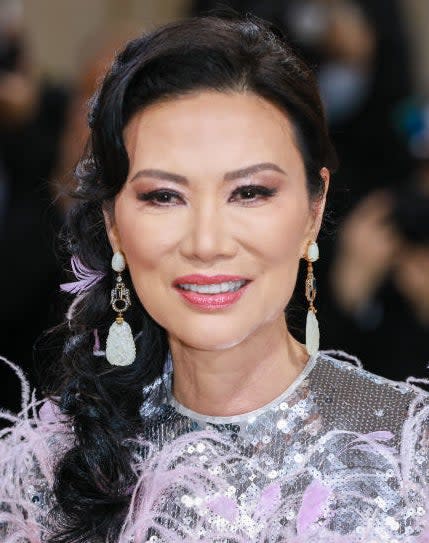 Closeup of Wendi Murdoch's face and earrings