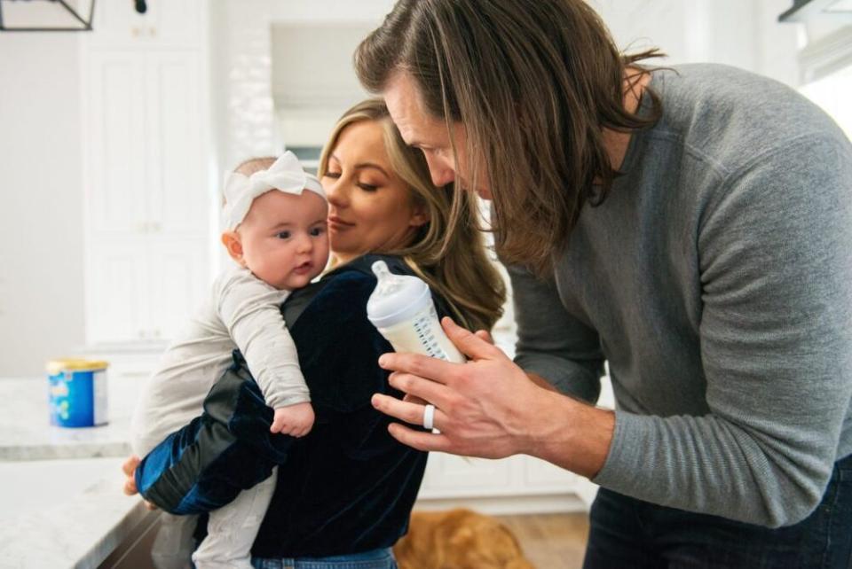 Andrew (R) and Shawn Johnson East with daughter Drew | Yve Assad/Enamfil