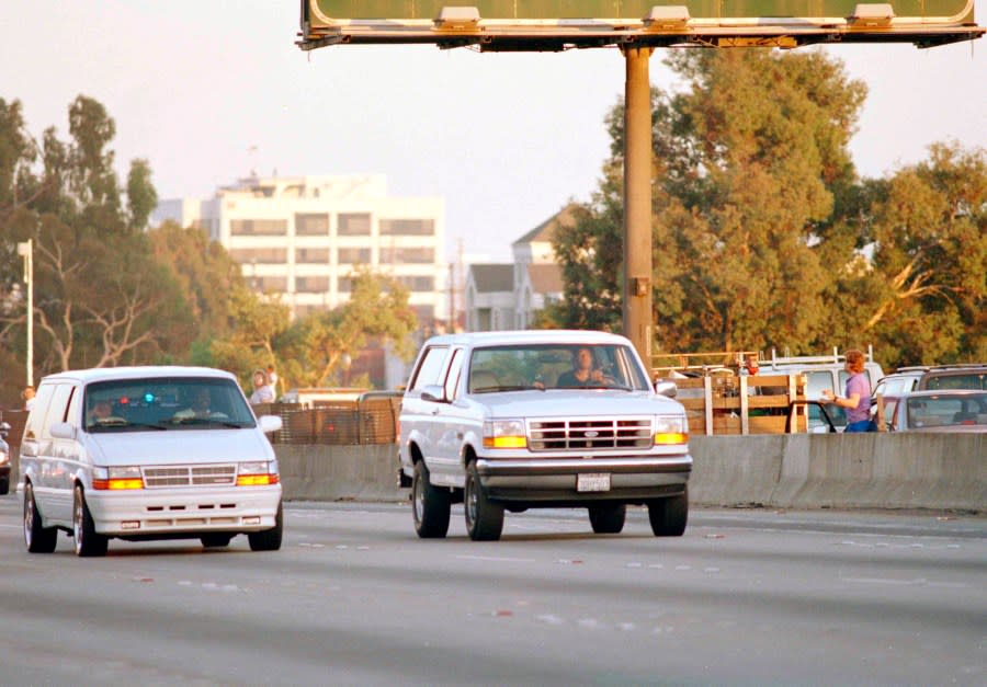 O.J. Simpson’s close friend Al Cowlings, at the wheel of a Ford Bronco with Simpson hiding, leads police on a two-county chase northbound 405 Freeway towards Simpson’s home, June 17, 1994, in Los Angeles. Simpson later surrendered to police and charged with two counts of murder in connection with the slayings of his ex-wife Nicole Brown Simpson and her friend Ronald Goldman. (AP Photo/Lois Bernstein)