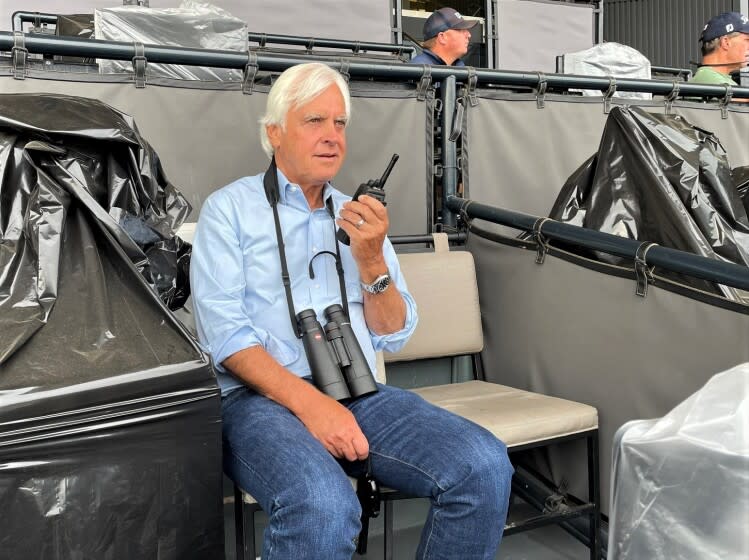 Trainer Bob Baffert watches a morning workout at Santa Anita Park on Sunday, July 3, 2022.