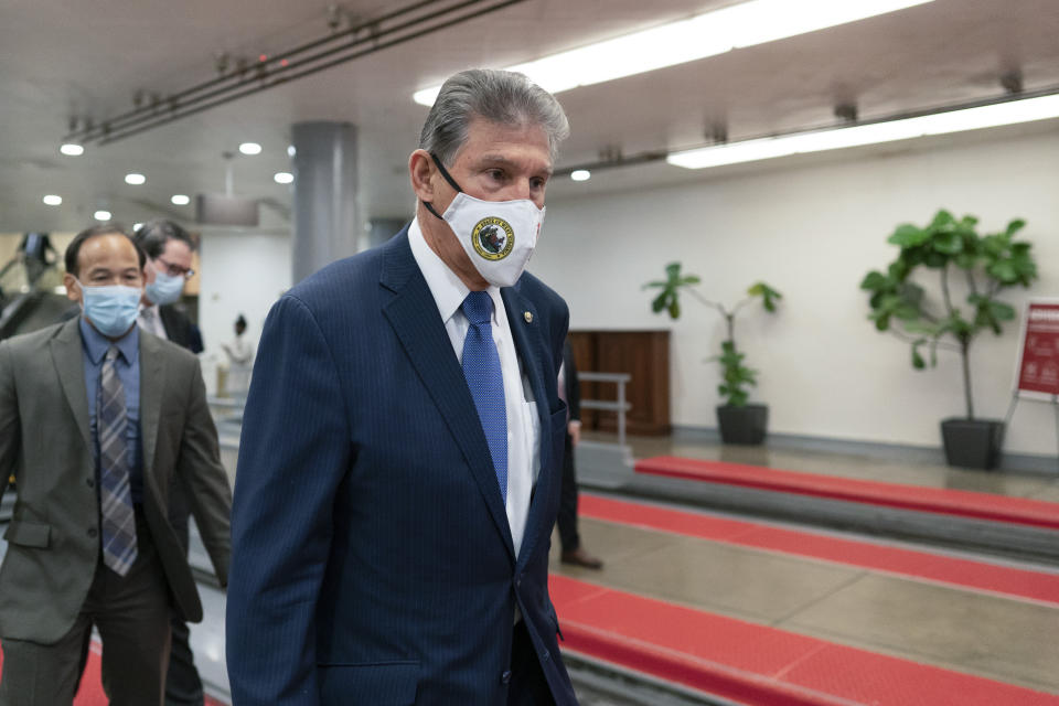 Sen. Joe Manchin, D-W.Va., walks through the subway on Capitol Hill in Washington, Thursday, Nov. 4, 2021. (AP Photo/Carolyn Kaster)