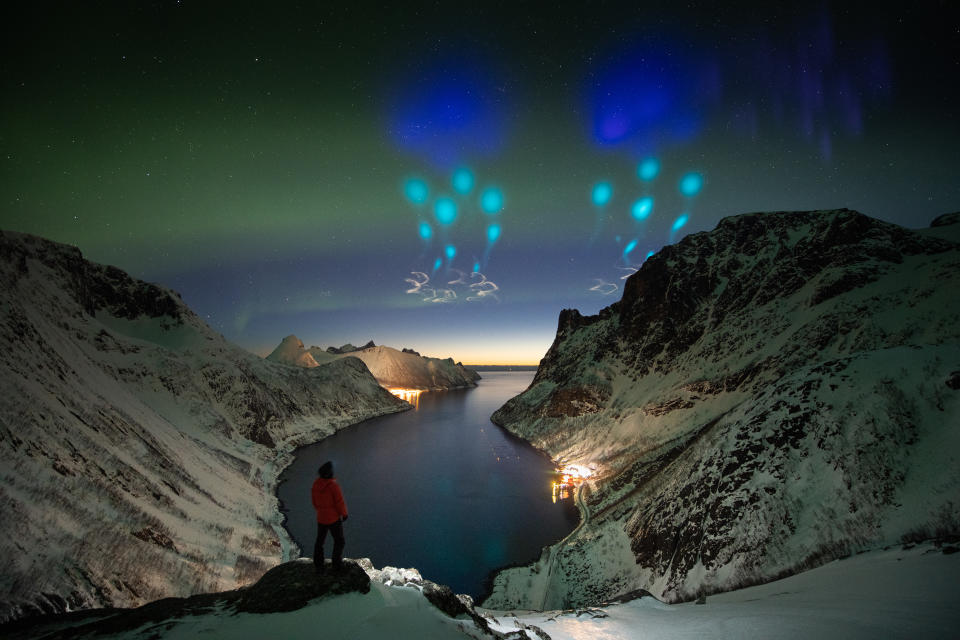 UNSPECIFIED, NORWAY - APRIL 06: A light show is seen at an Arctic fjord as National Aeronautics and Space Administration (NASA) carries out an experiment named the Auroral Zone Upwelling Rocket Experiment (AZURE) on April 6, 2019 in northern Norway. The lights were created by releasing two harmless gases into the atmosphere, trimethylaluminum and a mixture of barium and strontium, for researchers to study the paths of particles in the Earth's ionosphere, NASA says. (Photo by Yang Sutie/VCG via Getty Images)