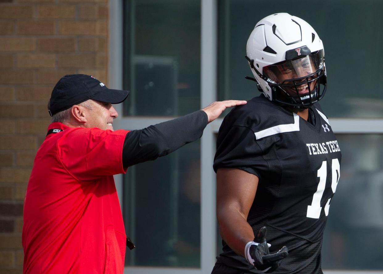 Texas Tech coach Joey McGuire, pictured with defensive end Tyree Wilson, makes his Red Raiders debut on Saturday in the season opener against Murray State.