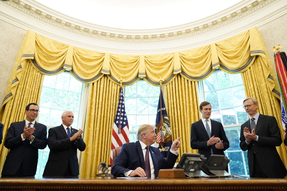 President Donald Trump speaks in the Oval Office of the White House on Friday, Sept. 11, 2020, in Washington. Bahrain has become the latest Arab nation to agree to normalize ties with Israel as part of a broader diplomatic push by Trump and his administration to fully integrate the Jewish state into the Middle East. From left, Treasury Secretary Steven Mnuchin, Vice President Mike Pence, Trump, Jared Kushner and U.S. special envoy for Iran Brian Hook. (AP Photo/Andrew Harnik)