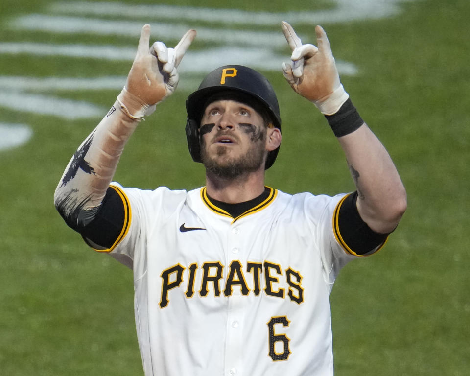 Pittsburgh Pirates' Yasmani Grandal celebrates as he crosses home plate after hitting a three-run home run off Chicago Cubs pitcher Keegan Thompson during the fifth inning of a baseball game in Pittsburgh, Saturday, May 11, 2024. (AP Photo/Gene J. Puskar)