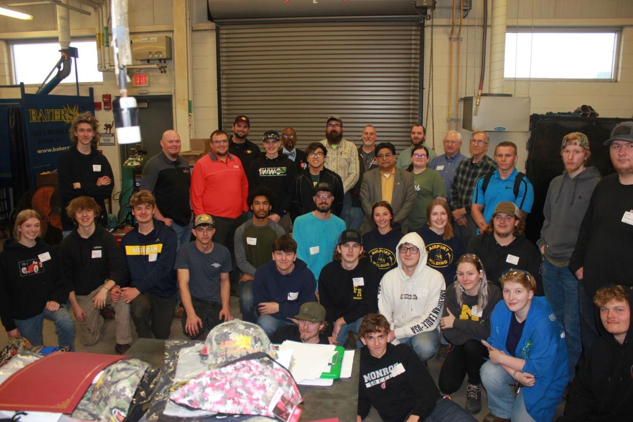 Twenty regional high school seniors took part in this year's welding skills competition at Monroe County Community College. Students are shown with their instructors.