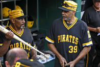 Members of the 1979 Pittsburgh Pirates World Championship team Dave Parker (39) and Mike Easler, left, wait in the dugout before a pre-game ceremony honoring the team before a baseball game between the Pittsburgh Pirates and the Philadelphia Phillies in Pittsburgh, Saturday, July 20, 2019. (AP Photo/Gene J. Puskar)