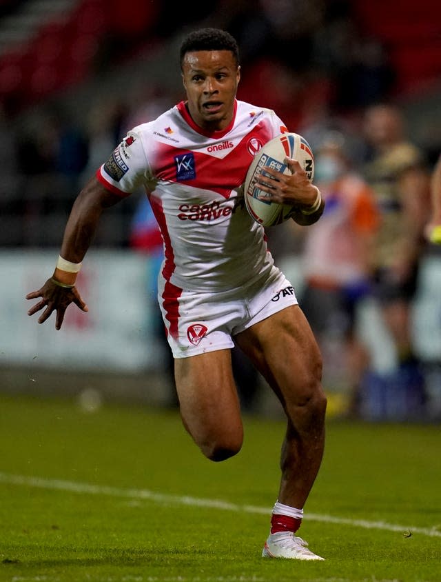 Regan Grace runs with the ball in her hand while playing for St Helens