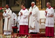 Pope Francis leads the Christmas night Mass in Saint Peter's Basilica at the Vatican December 24, 2016. REUTERS/Tony Gentile