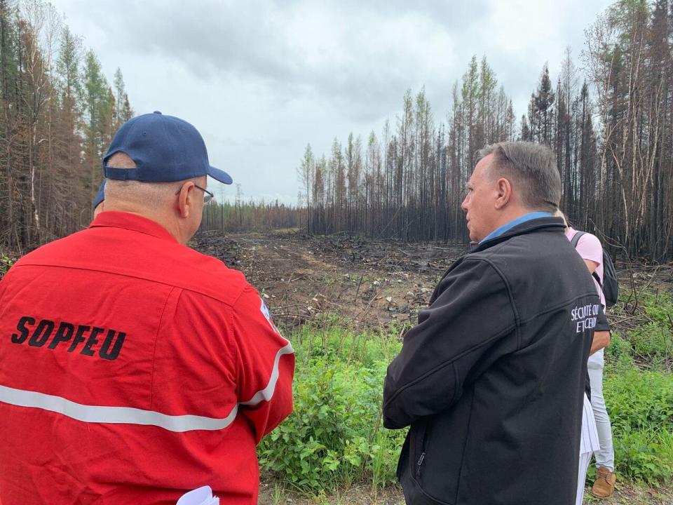 Premier François Legault visited a trench around Normétal created to protect the village from forest fires in 2023.