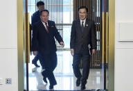 South Korean Unification Minister Cho Myoung-gyon, right, and his North Korean counterpart Ri Son Gwon arrive to hold their meeting at the southern side of Panmunjom in the Demilitarized Zone, South Korea, Monday, Oct. 15, 2018. The rival Koreas are holding high-level talks Monday to discuss further engagement amid a global diplomatic push to resolve the nuclear standoff with North Korea. (Korea Pool/Yonhap via AP)