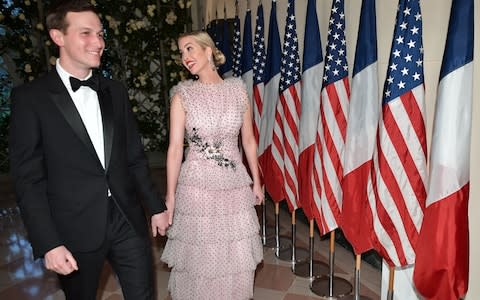 Ivanka Trump and husband Jared Kushner, Trump's senior advisor arrive in the Booksellers Area of the White House to attend a state dinner honoring French President Emmanuel Macron - Credit: AFP